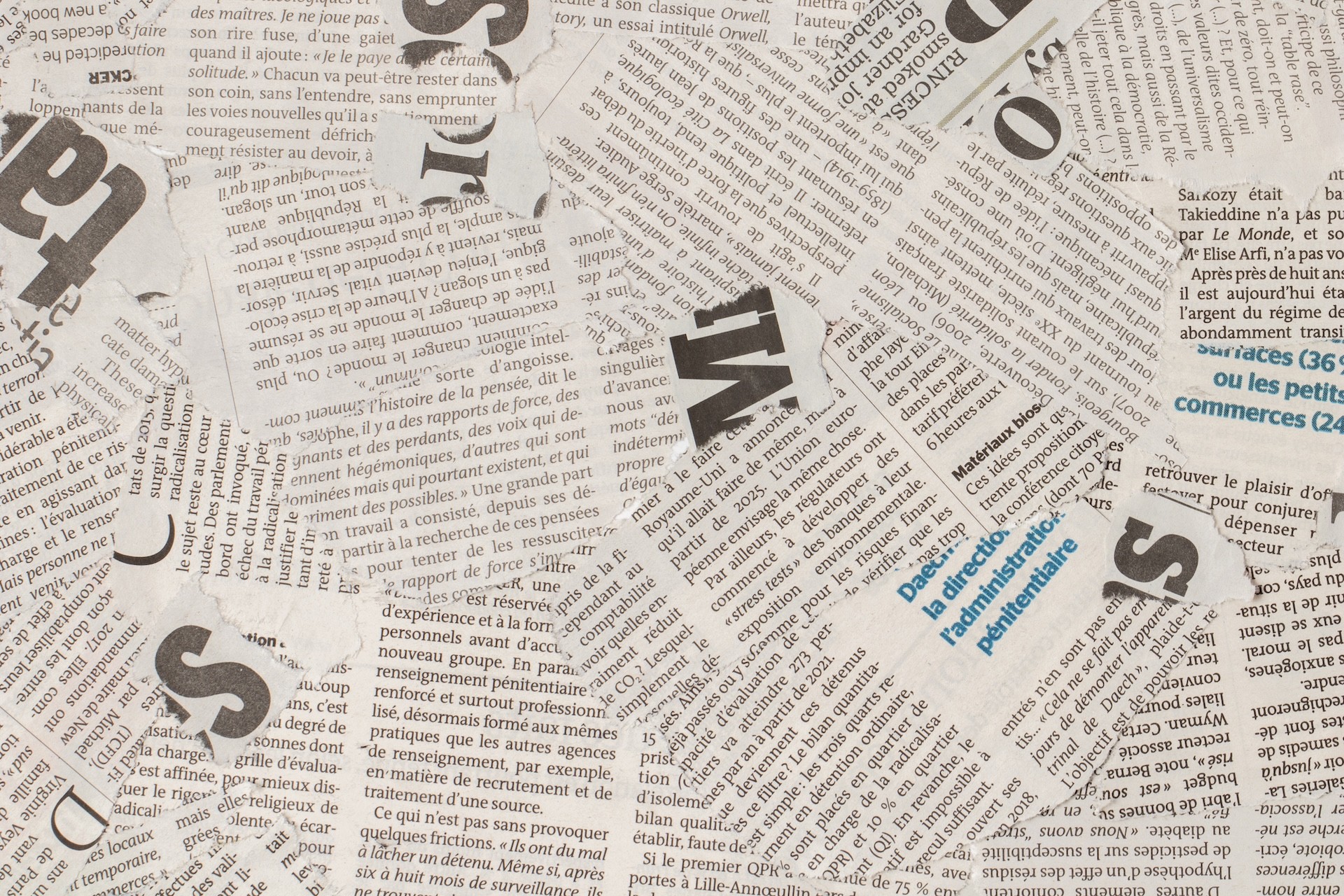 /photos/shares/top-view-old-french-newspaper-pieces.jpg